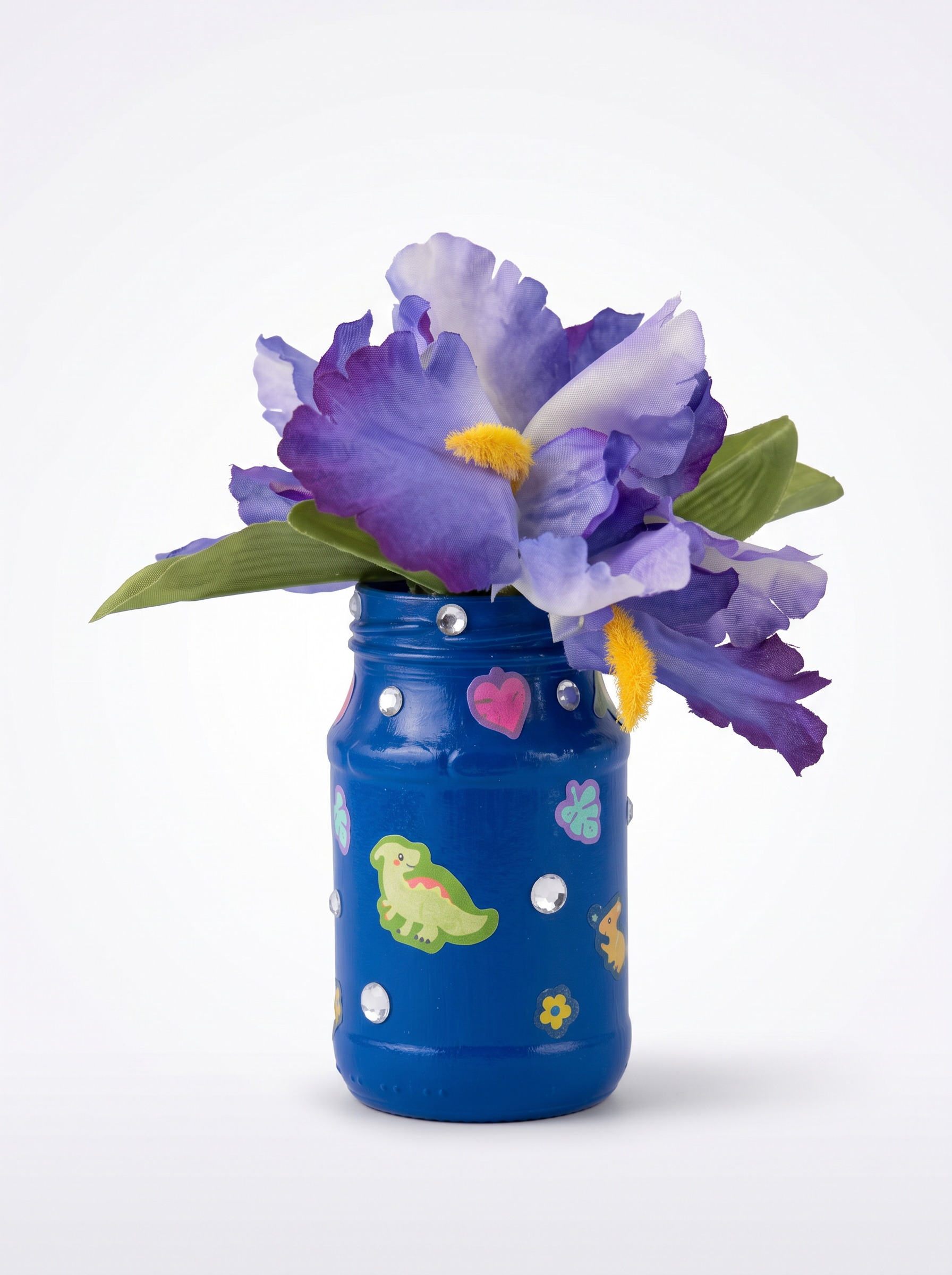 Royal blue dinosaur-themed jar vase with purple flowers