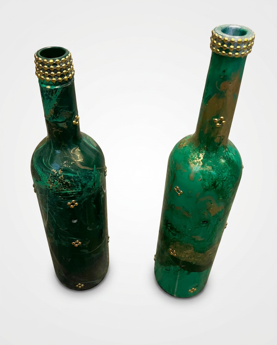 Two emerald green and gold marbled bottles with gold bead trim
