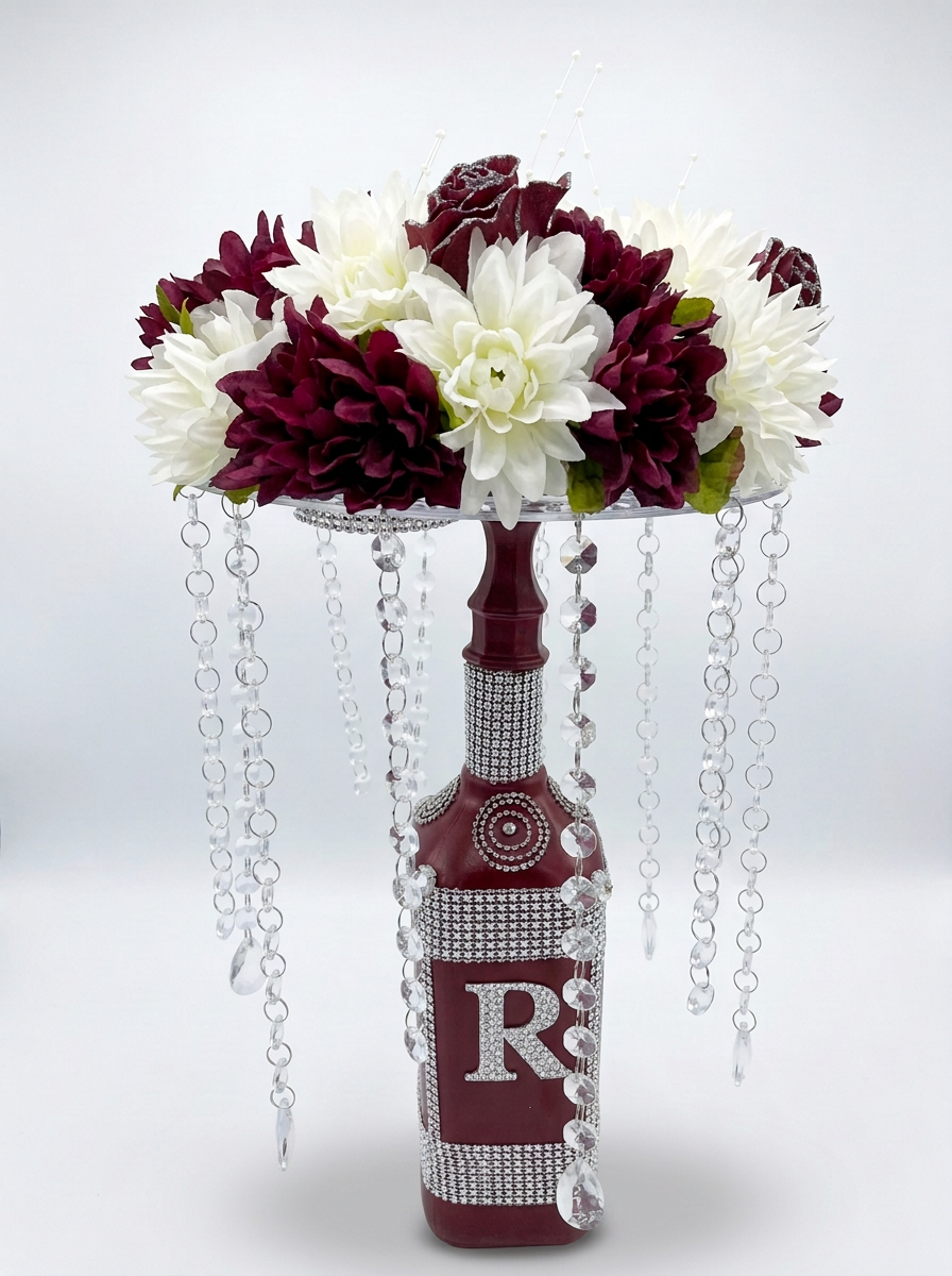Burgundy memory lamp centerpiece with rhinestone letter R, white and burgundy flowers, and hanging crystal beads