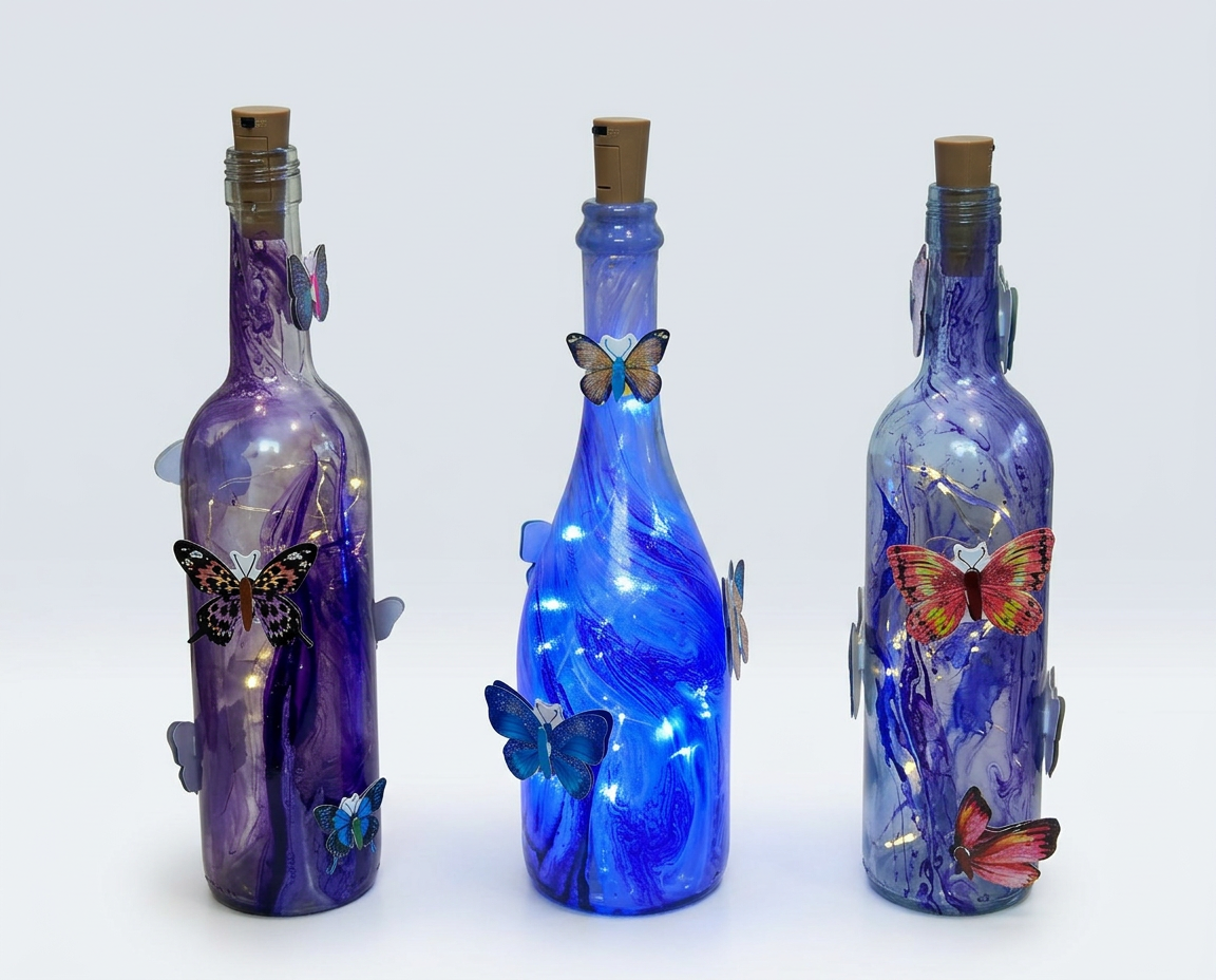 Purple and blue swirled lighted bottles with raised butterflies on a clean white background